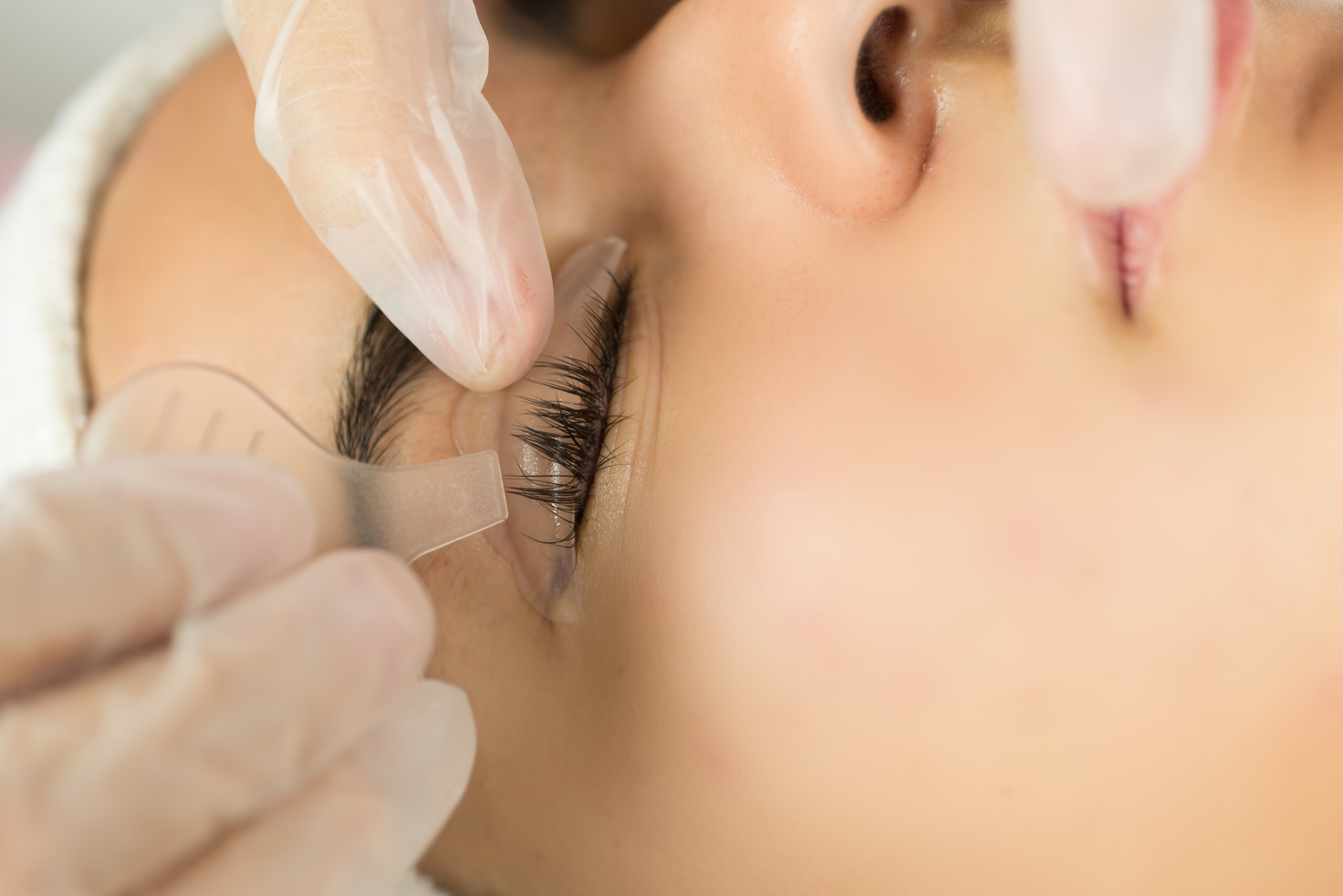 Eyelash treatment applied to a young woman
